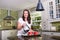 Attractive woman pouring homemade coffee for two in modern sunny kitchen