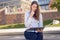 Attractive woman reading a business file in a park