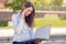 Attractive woman reading a business file in a park