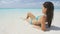 Attractive Woman Reclining On Beach During Summer On Travel Vacation Holidays