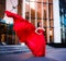 Attractive woman in red fluttered dress. Fire, flame, passion concept.