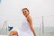 Attractive woman smiling sitting on yacht in sea