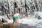 Attractive woman splashes water on waterfall