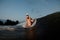 Attractive woman standing on the one knee on the wakesurf