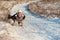 Attractive woman tobogganing downhill