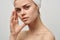 attractive woman with towel on head naked shoulders pimples on face acne skin care