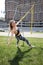 Attractive woman training on TRX outdoors, morning workout. Adult healthy fitness