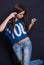 Attractive woman wear blue crop top and ripped blue jean pants