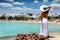 Attractive woman in white views the traditional village of Ano Koufonisi, Koufonisia