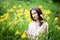 Attractive woman in yellow flowers day-lily field