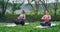 Attractive women at nature concentrated doing yoga poses meditation while taking some fresh air in amazing mountain