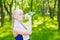 Attractive young blonde woman drinking water from plastic bottle after workout