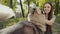An Attractive Young Blonde Woman Play With Purebred Siberian Husky Dog In Park,
