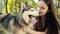 Attractive Young Blonde Woman Play With Purebred Siberian Husky Dog Stroking,