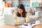 Attractive young business asian woman holding, clutching crumpled paper. Young university student get angry and grimace face