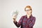 Attractive young businesswoman posing with bunch of USD cash in hands showing positive emotions and happy facial expression.