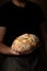 Attractive young Caucasian chef posing with white sourdough bread