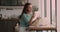 Attractive young caucasian woman reading paper correspondence.