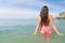 Attractive Young Caucasian Woman In Swimsuit On Beach Back Rear View, Girl Blue Sea Water Holiday