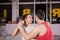 Attractive young couple dancing in big studio hall