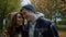 Attractive young couple lucky being together outdoors in autumn weather.