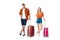 attractive young couple with suitcases looking at camera
