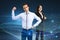 Attractive young european businessman and woman flexing muscles on abstract glowing blue metaverse background. Digital world,