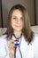 Attractive young female doctor. Focus on the Paraguay flag stethoscope