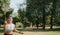 Attractive Young Girls Having Fun Playing Badminton in the Park on a Sunny Day