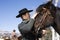 Attractive Young Man Petting Horse