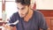 Attractive young man in restaurant eating