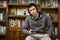 Attractive young man sitting listening to music