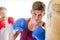Attractive young man using a punching bag