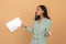 attractive young office worker holding bunch of papers