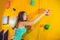 Attractive young professional sport climber woman having trainin