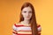 Attractive young sincere redhead girl clean pure perfect skintone smiling modest look camera friendly delighted standing