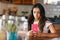 Attractive young teenage girl reading on her mobile phone