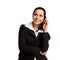 Attractive young woman calling by cellular phone.