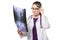 Attractive young woman doctor looking at x-ray holding magnifier near her head making diagnosis in white uniform on