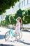 Attractive young woman enjoying riding her bicycle