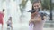 Attractive young woman feeding pigeons in the park