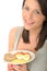 Attractive Young Woman Holding a Healthy Norwegian Breakfast