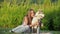 Attractive young woman hugs funny siberian husky dog