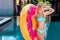 attractive young woman inflatable ring in shape of donut