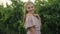 Attractive young woman posing while walking in vineyards