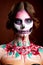 Attractive young woman with sugar skull makeup
