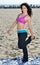 Atttractive woman working out on beach