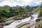 Atukkad Waterfalls near Munnar in Kerala, South India on cloudy day in rain season