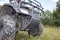 ATV Close-up on the Background of the Forest Outside the City. ATV on the Forest off-road, Front View. Summer Travel on Quad Bike