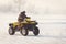 ATV driving on a snowy highway